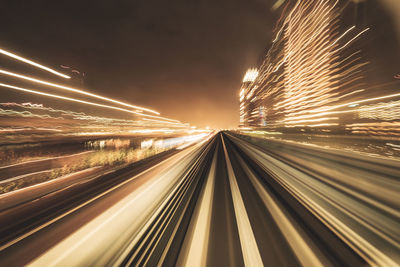 Motion blurred of train moving inside tunnel with daylight in tokyo, japan.