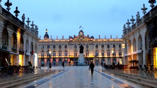 Tourists at entrance of historic building