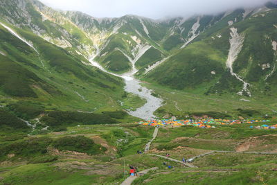 High angle view of people on land against mountains