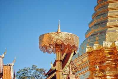 Low angle view of traditional building against clear blue sky