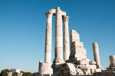 Low angle view of historical building against blue sky