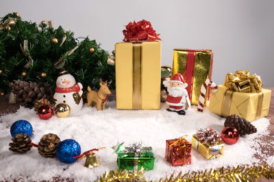 Close-up of christmas decorations against white background