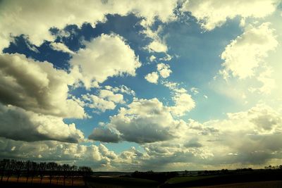 Scenic view of landscape against cloudy sky