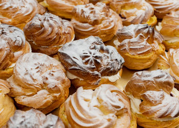 Cream puffs filled with cream and fruity cherries