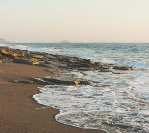 Scenic view of beach against clear sky