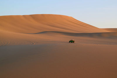 Scenic view of desert against clear sky