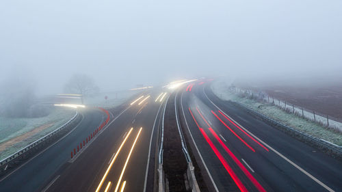 High angle view of light trails on road