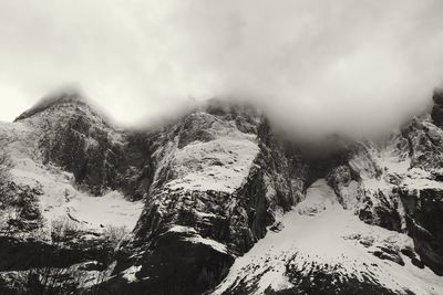 Scenic view of snow covered mountains against sky