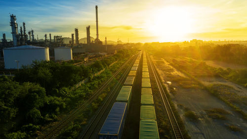 High angle view of railroad tracks against sky during sunset