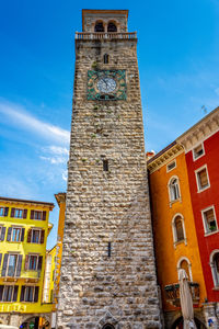 Low angle view of clock tower against building