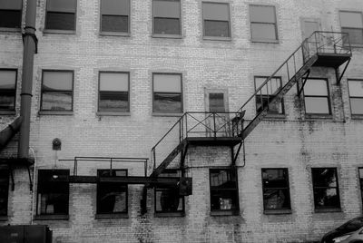 Low angle view of fire escape against building