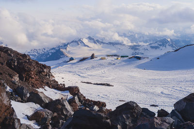 Snowy winter greater caucasus mountains at sunny day, view from ski slope elbrus.