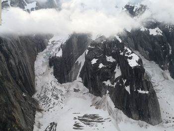 High angle view of snowcapped mountains against sky