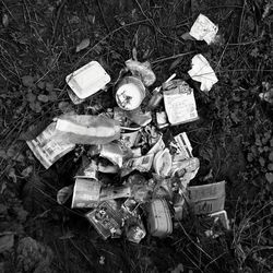 High angle view of garbage bin on field