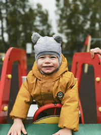 Portrait of smiling boy in playground