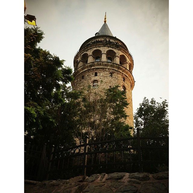 transfer print, architecture, built structure, building exterior, auto post production filter, sky, tower, tree, low angle view, religion, place of worship, church, history, spirituality, travel destinations, day, famous place, outdoors