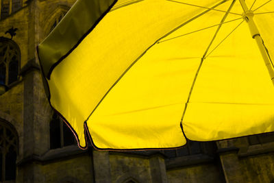 Low angle view of yellow parasol