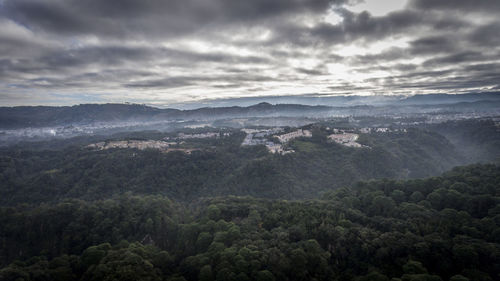 High angle view of trees and mountains against sky