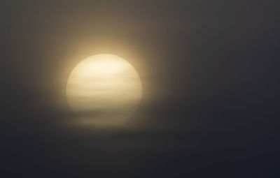 Scenic view of moon against sky during sunset