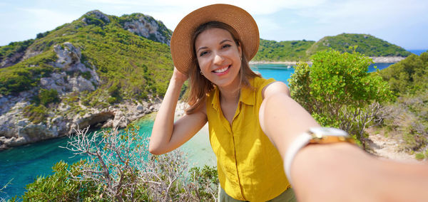 Selfie picture of hiker girl from porto timoni viewpoint in corfu, greece, europe.