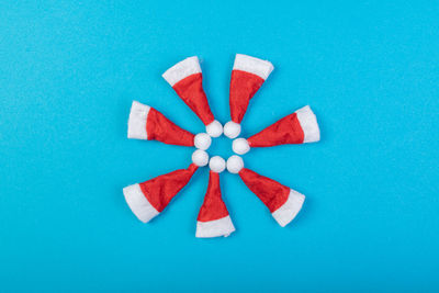 High angle view of multi colored umbrella on blue background