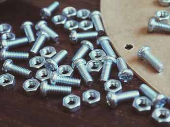 Close-up of nuts and bolts on table