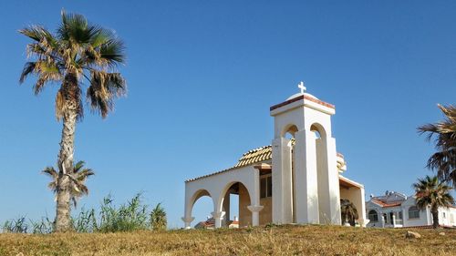 Low angle view of church against blue sky