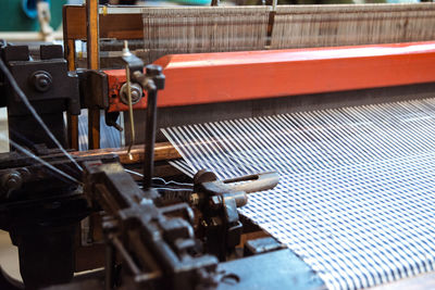 Close-up of weaving machine in museum
