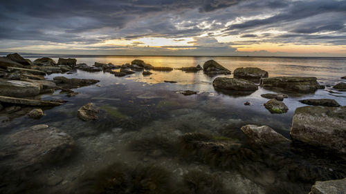 Scenic view of sea against sky during sunset