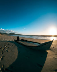 Scenic view of beach against blue sky