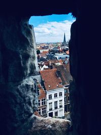 Houses in city against sky