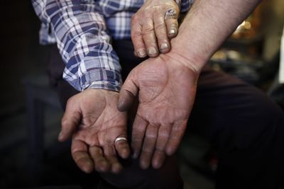 Close-up of friends showing hands at home