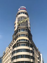 Low angle view of building against blue sky