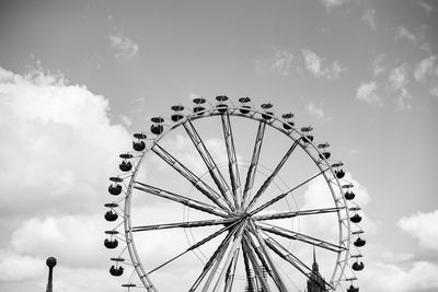 Low angle view of ferris wheel against sky