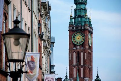 Low angle view of clock tower in city