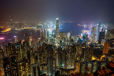 High angle view of illuminated city buildings at night