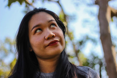 Portrait of woman looking up
