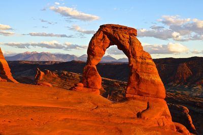 Rock formations on landscape against sky