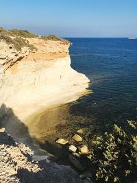 High angle view of rocks on beach against sky