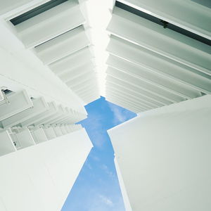 Low angle view of cross against sky