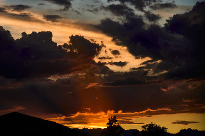 Low angle view of dramatic sky during sunset