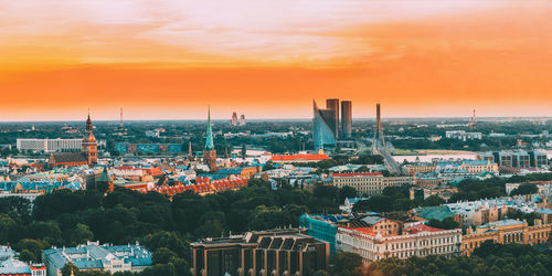 Townscape against sky during sunset