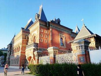 Low angle view of historic building against clear blue sky