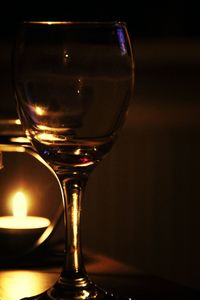 Close-up of wine glasses on table