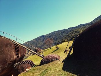 Scenic view of mountains against clear blue sky