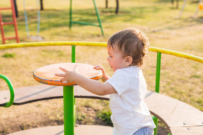 Cute boy playing on playground