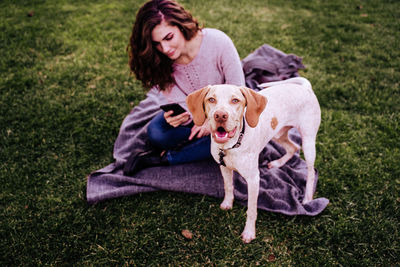 Portrait of a dog sitting on grass