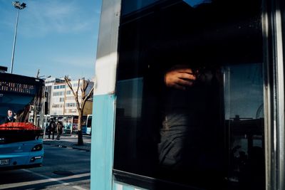 People on street seen through glass window