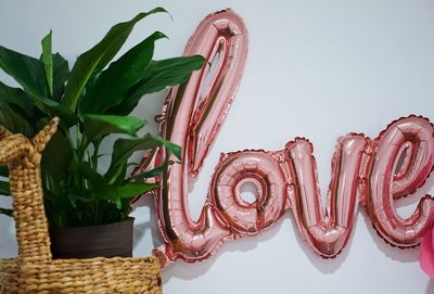 Close-up of cake on table against white background