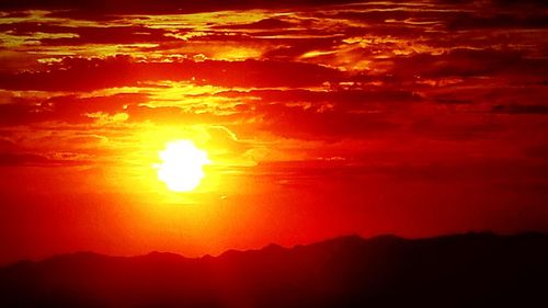 Scenic view of dramatic sky during sunset